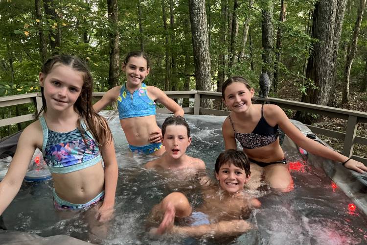 The Anderson’s grandkids enjoying the hot tub at Puckett’s Point Lake House 